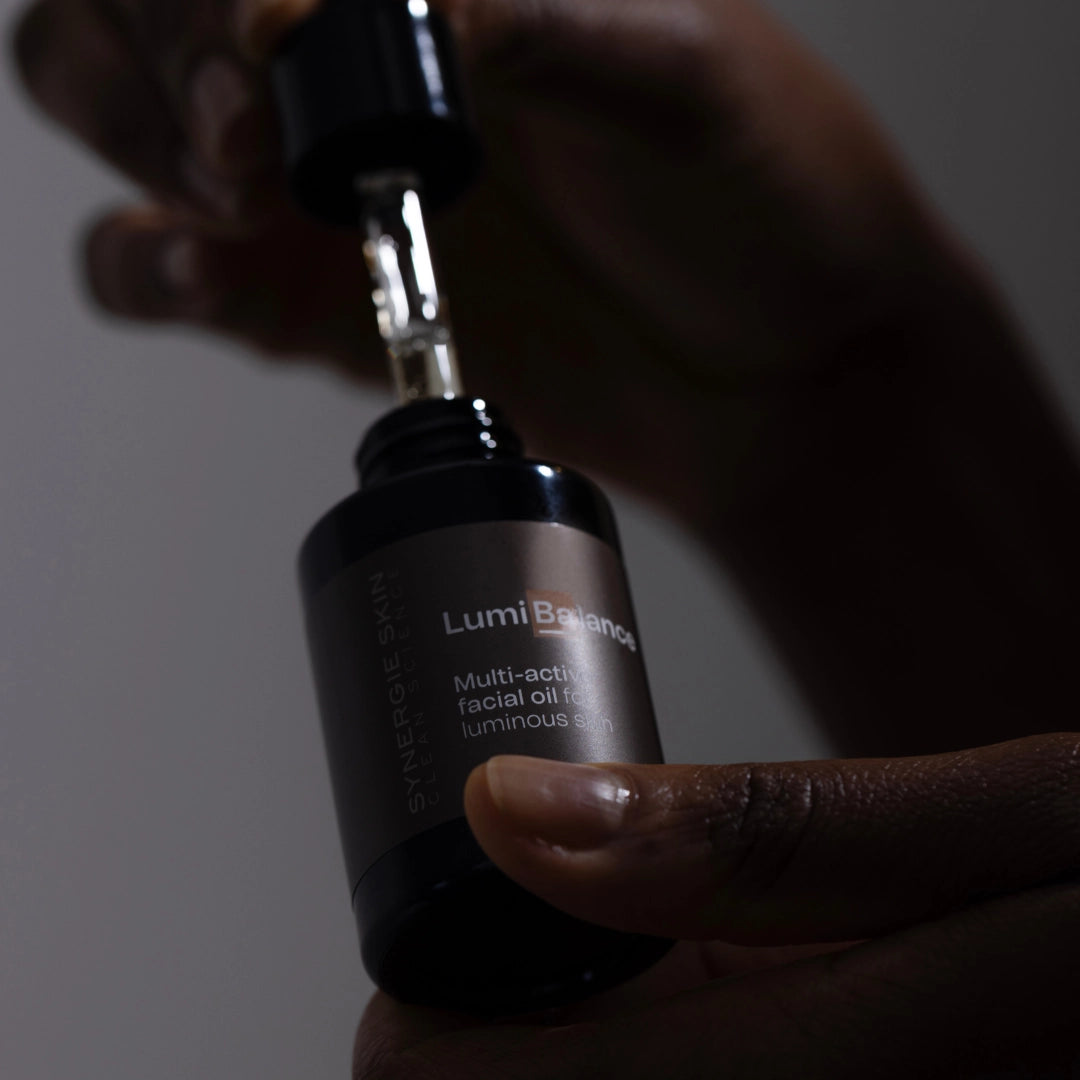 Woman posing with Synergie Skin LumiBalance