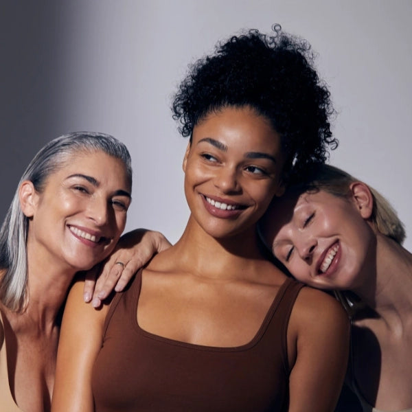 3 models laughing and smiling together