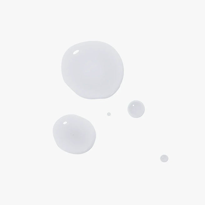 Dermiotic elixir fortified with prebiotics and probiotics to balance the surface microbiome of the skin. Skincare texture