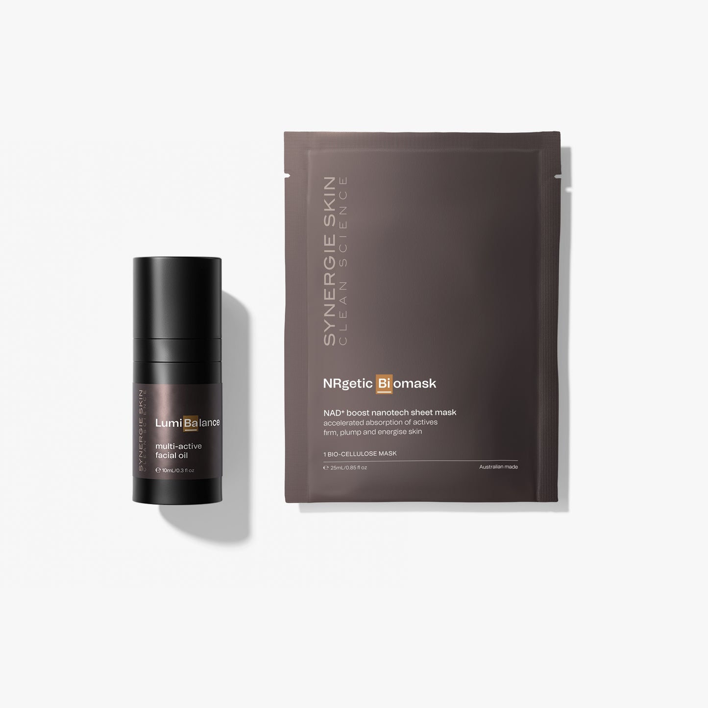 A skincare set featuring a LumiBalance bottle and an NRgetic Biomask pouch, arranged on a clean white background with soft shadows.