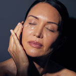 Model applying ImprovEyes Night to their face