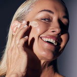 Model applying ReClaim onto her face