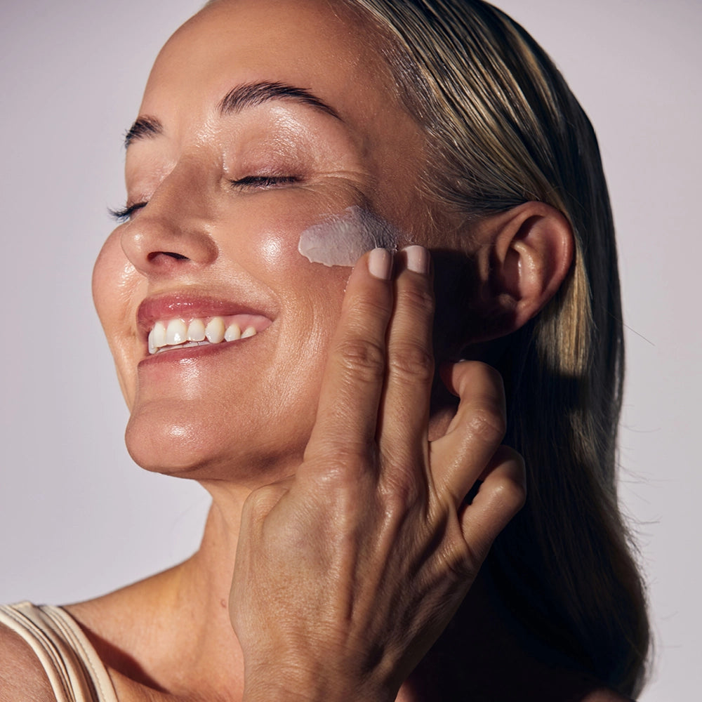 Model applying UberZinc to their face